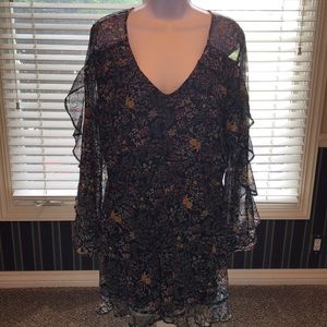 Sheer floral print long sleeve romper in black